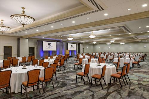 a banquet hall with tables and chairs in a room at DoubleTree by Hilton Minneapolis Airport, MN in Bloomington