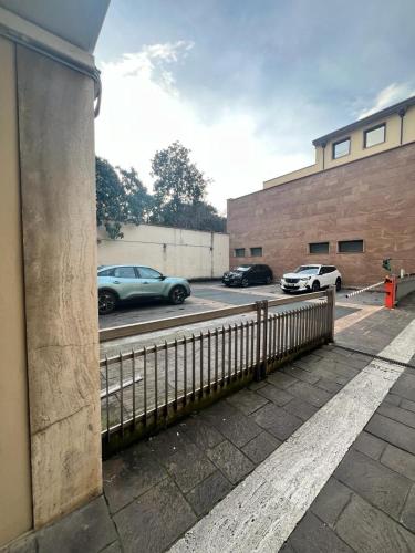 a view of a parking lot with cars on a street at La Farina Apartments in Florence