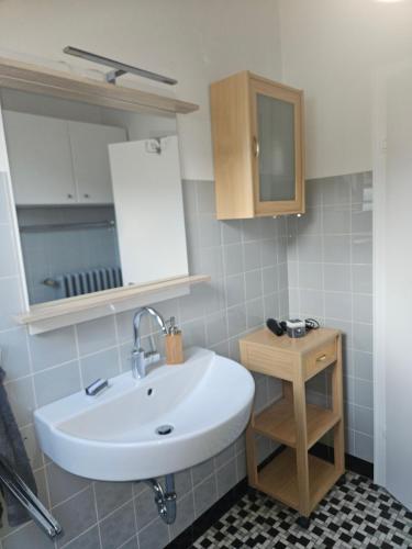 a bathroom with a sink and a mirror at Ferienhaus Eggetal in Preußisch Oldendorf