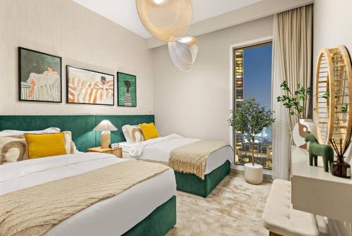 a hotel room with two beds and a window at Chic 2BR Stay at Creek Horizon with Pool, Gym and Prime Dubai Location in Dubai