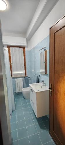 a bathroom with a sink and a toilet and a tub at Umbria Tuoro in Tuoro sul Trasimeno