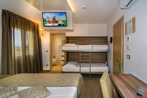 Postel nebo postele na pokoji v ubytování Hotel Pineta Mare