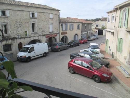 a group of cars parked on a city street at Appartement 4 Pers VERGEZE in Vergèze