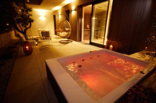 a bath tub filled with water in a room at The home by the river in Bellano