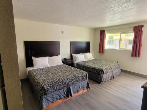 Ένα ή περισσότερα κρεβάτια σε δωμάτιο στο Econo Lodge Las Vegas