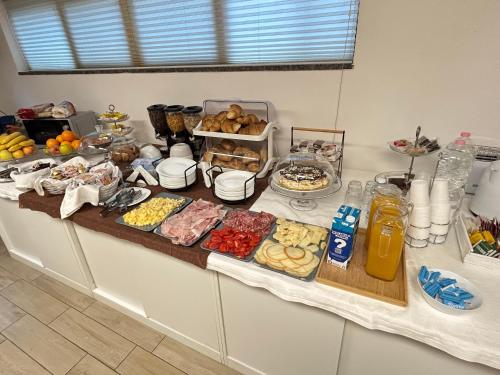 a buffet with many different types of food on a table at Hotel Due Pini Conte in Angri