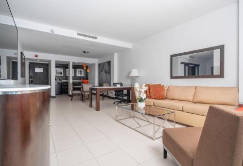 a living room with a couch and a table at The Condado Plaza Hotel in San Juan