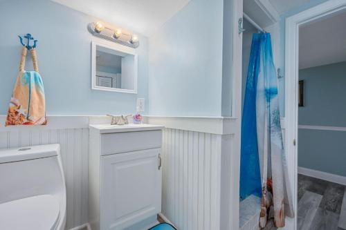 a bathroom with a white toilet and a shower at 215 Phillips Road Sagamore Beach - Cape Cod in Sagamore Beach