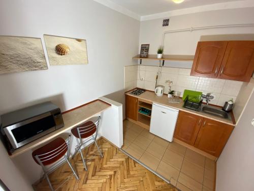 Η κουζίνα ή μικρή κουζίνα στο Apartments Legendary Kraków