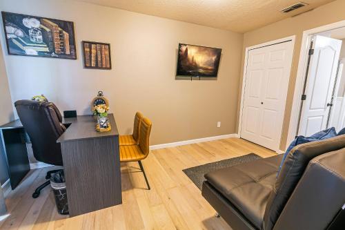 a living room with a table and a couch at Thematic House with Private PoolSpaGame Room in Loughman