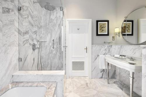 a bathroom with a shower and a sink at Hotel Bristol, A Luxury Collection Hotel, Warsaw in Warsaw