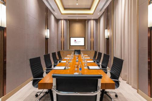 a large conference room with a long table and chairs at Phuket Marriott Resort & Spa, Merlin Beach in Patong Beach