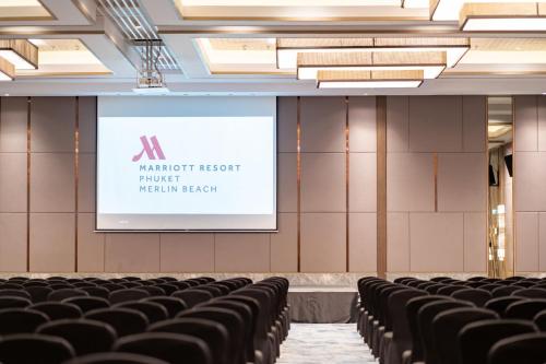 a lecture hall with black chairs and a screen at Phuket Marriott Resort & Spa, Merlin Beach in Patong Beach