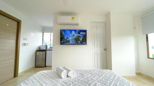 Postel nebo postele na pokoji v ubytování Magico Apartaestudio con Piscina 1 Habitacion PR46C