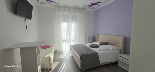 Кровать или кровати в номере Orchidea