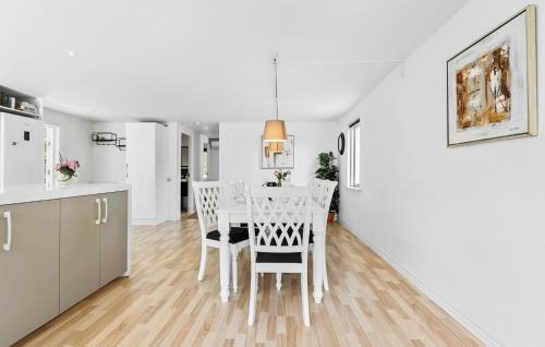 a kitchen and dining room with a table and chairs at Gorgeous Home In Grevinge With Wifi in Grevinge