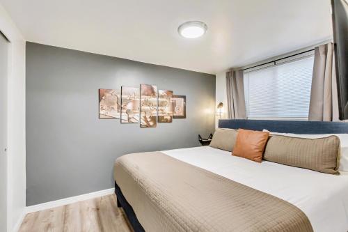 a bedroom with a large bed and a window at Marmalade by Cloud Dream Homes in Salt Lake City