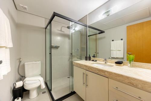 a bathroom with a shower and a toilet and a sink at STD - Anora Spaces - Stadium Alphaville in Barueri