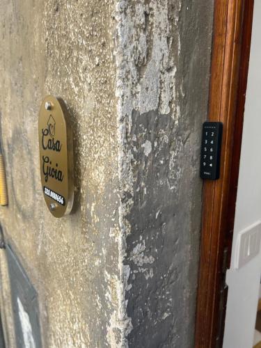 a door with a sign on the side of it at Casa gioia in Bracciano