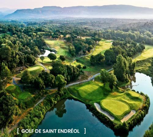an aerial view of the golf course at the lake at Bastide de Garidelle in Callas