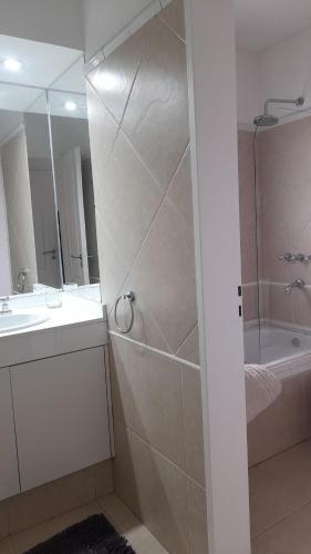 a bathroom with a shower and a sink at BarrancasdelGolfo in Puerto Madryn