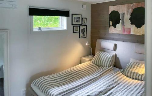 a bedroom with a bed and a window at Lovely Home In Heby With Wifi in Heby