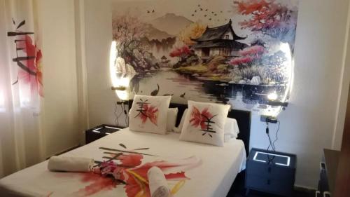 a bedroom with a bed with a painting on the wall at Contemporary Villa in Atarfe with Private Pool and Mountain View in Atarfe