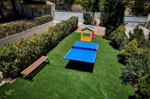 an overhead view of a table and a dog house at Luxury Maisonette with Pool in Pallíni
