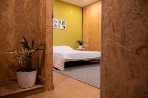Ένα ή περισσότερα κρεβάτια σε δωμάτιο στο Ginger Villa Farmstay, Thodupuzha