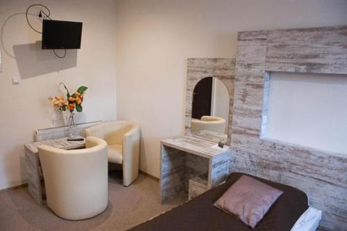 a bathroom with a tub and a sink and a mirror at Jaś i Małgosia in Poraj