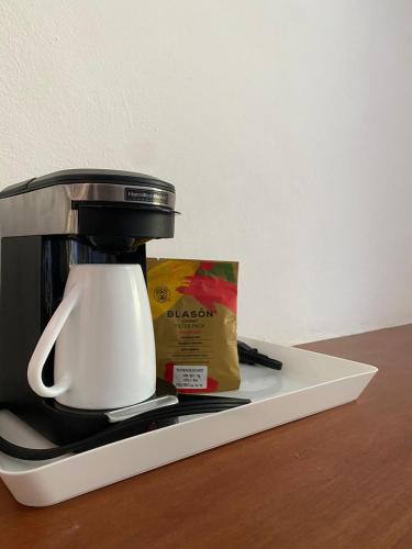 a coffee maker sitting on top of a counter at Hotel Pelecanus Suites Holbox in Holbox Island