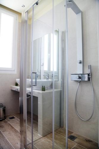 a bathroom with a shower and a sink at My Athens House in Athens