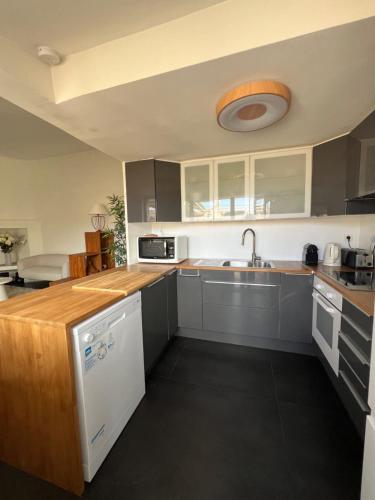 a kitchen with a sink and a counter top at Hypercenter lovely duplex with Terrace CLIM WIFI in Aix-en-Provence