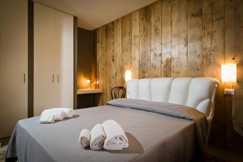 מיטה או מיטות בחדר ב-Via Nuova