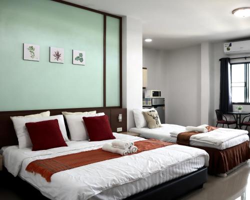 Ένα ή περισσότερα κρεβάτια σε δωμάτιο στο Aree Place Chiang Mai