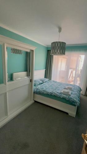 a small bedroom with a bed and a window at SIBIU Bach Penthouse in Sibiu