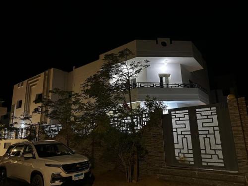 a car parked in front of a building at night at Miral in Dahab