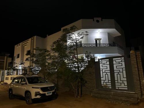 a car parked in front of a building at night at Miral in Dahab