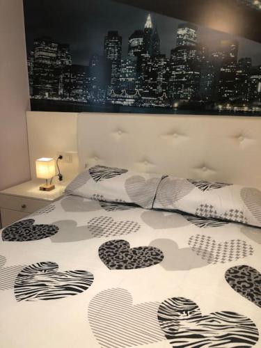 a bedroom with a bed with hearts on it at Toxiños in Carballino