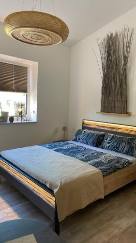 a bedroom with a large bed in a room at Nordwind in Osterholz-Scharmbeck