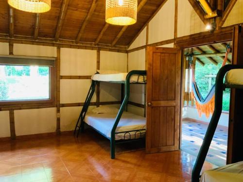 Katil atau katil-katil dalam bilik di Hacienda Finca La Querendona