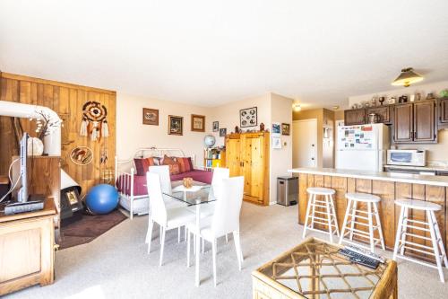 a kitchen and living room with a table and chairs at Dillon Valley East 301Q in Dillon