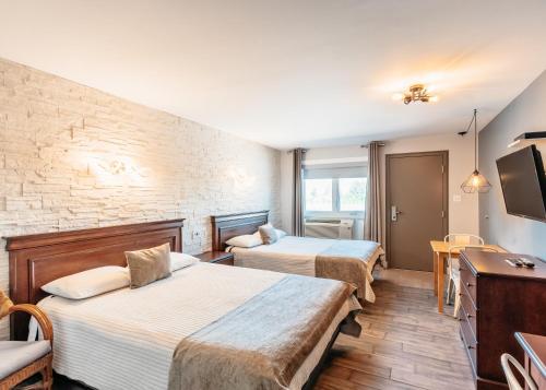 Postel nebo postele na pokoji v ubytování Hotel Motel Le Quiet