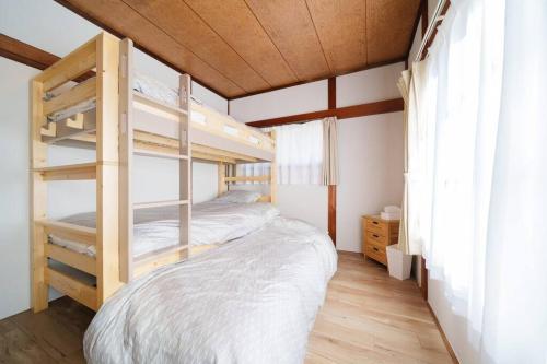 Postel nebo postele na pokoji v ubytování 名古屋城に1番近い名古屋市北区若鶴民泊