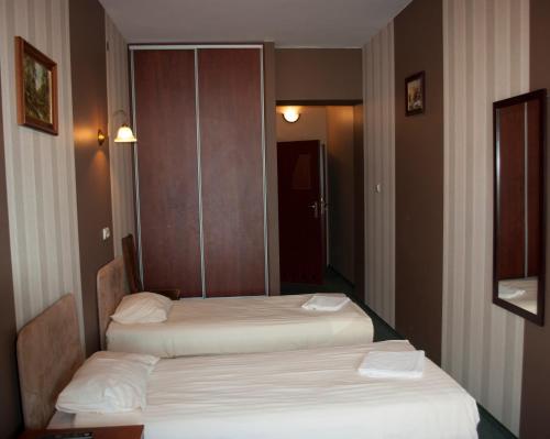 Postel nebo postele na pokoji v ubytování Hotel Nad Rzeczką