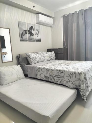 Postel nebo postele na pokoji v ubytování MattiGab Homestay -studio type condo
