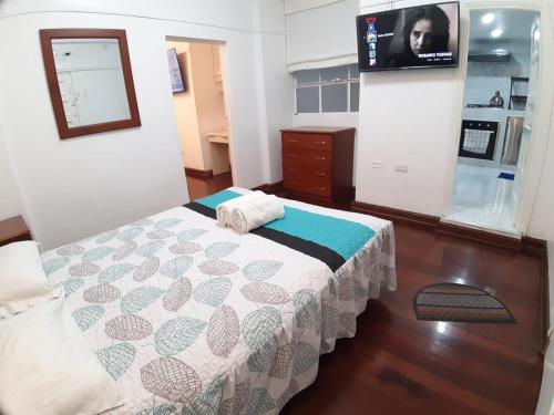 Postel nebo postele na pokoji v ubytování APARTAMENTO LINDO - A 2 Cuadras de la Plaza de Armas y del Palacio de Gobierno