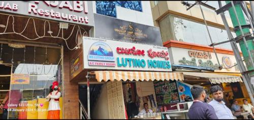 a group of signs on the side of a building at Lavish residency near to Rammurthynagar main road in Bengaluru