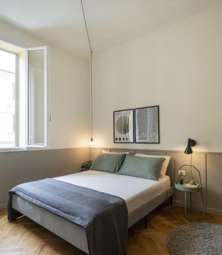 a bedroom with a large bed in a room at LUZ 03 room in Bologna