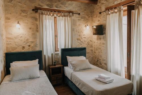 Ένα ή περισσότερα κρεβάτια σε δωμάτιο στο Villa Kalliopi